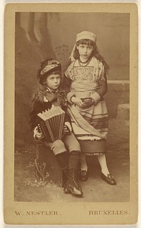 Two unidentified girls: one seated with an accordion, the other standing by Wilb Nestler