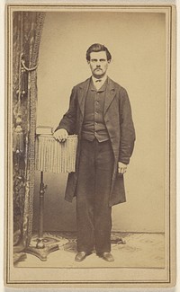 Unidentified man with moustache, standing by C Henning Smith
