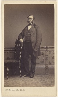 Unidentified man with long muttonchops, standing by C T Newcombe