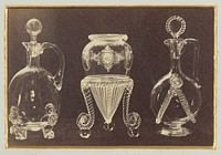 Two ornate decanters and one inverted vase by Alexander Nichol