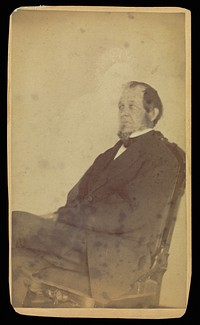 Unidentified man seated with female "spirit" by William H Mumler