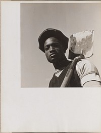 Portrait of a man holding a shovel over his left shoulder by Arnold Eagle