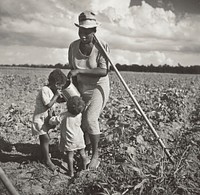 Black Woman Giving Her Children a Drink in the Field Where She's Hoeing Cotton on an FSA Cooperative Project (Allen Plantation) by Marion Post Wolcott