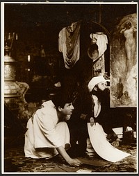 Two Male Models Crouched Down on Mucha's Studio Floor by Alphonse Maria Mucha