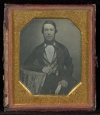 Portrait of a Man at a Table