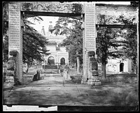 Biyunsi (Temple of Azure Clouds), Beijing: the Jingangta (Diamond Sutra Pagoda), viewed through a memorial arch. Photograph by John Thomson, 1871.