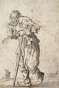 A bearded beggar, dressed in rags, holding a staff in his left hand. Etching with engraving possibly after J. Callot.