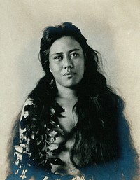 A Samoan woman with leaves in her hair.
