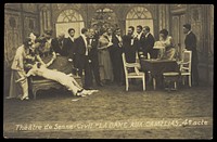 French or Belgian prisoners of war, some in drag, posing on stage during a crowded scene of "La dame aux camélias"; at Sennelager prisoner of war camp in Germany. Photographic postcard, 191-.