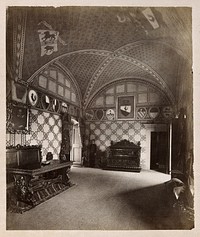 Galileo Galilei: interior of Villa del Gallo, Count Galletti's museum of Galileo, showing crests on the wall of a vaulted room and a painting of Galileo. Process print.