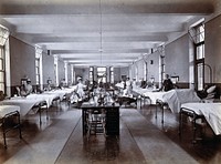 Johannesburg Hospital, South Africa: hospital ward with child patients and nurses. Photograph, c. 1905.