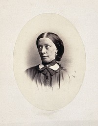 A woman's head and shoulders, her face is tilted to the right and her eyes are looking up. Photograph by L. Haase after H.W. Berend, 1865.