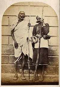 Oude, India: two men holding long sticks. Photograph, ca. 1860.