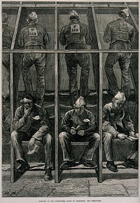 Middlesex House of Correction: male prisoners treading on the boards of a treadmill: in the foreground others sit resting. Wood engraving by W.B. Gardner, 1874, after M. Fitzgerald.