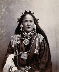 Ani Chokyi, a Sikkimese/Tibetan woman resident in Darjeeling, wearing elaborate jewellery, costume and head-piece. Photograph by T. Paar, ca. 1890.