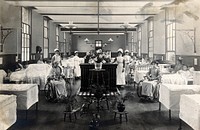 St Marylebone Infirmary, London: ward with nurses and patients. Photograph, 1910.