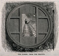 An underground tunnel with a truck on the track. Wood engraving, 1868.