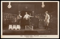 British prisoners of war performing a circus act for "The Timbertown Follies", at a prisoner of war camp in Groningen. Photographic postcard, 191-.