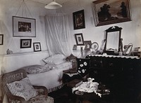 Johannesburg Hospital, South Africa: bed and sitting room, possibly staff quarters. Photograph, c. 1905.