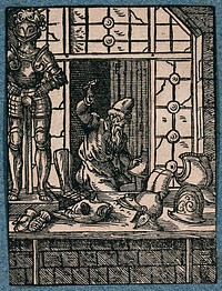 An armourer is is beating metal into shape as armour for men and horses. Woodcut by J. Amman.