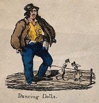 A man has two dancing dolls on a board, controlled by a string attached to his leg. Coloured etching.