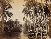 Singapore: a western hunter and native Malays with a background view of the Roman Catholic Mission Church at Bukit Timah. Photograph by J. Taylor, 1880.