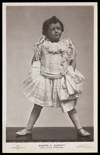 Edward Garratt in character as "The little stranger". Photographic postcard, ca. 1906.