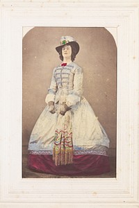 A man in drag wearing an elaborate dress and feathered hat.