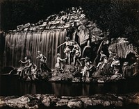 Caserta Royal Palace, Naples, Italy: Diana with her nymphs: sculptures in front of a waterfall in the palace gardens. Photograph, ca. 1870, of marble sculptures, ca. 1750.