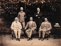The five members of the Bombay Plague Committee, three sitting, two standing. Photograph attributed to Captain C. Moss, 1897.