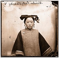 Peking, Pechili province, China: a Manchu lady wearing a coiffure. Photograph by John Thomson, 1869.