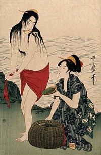Two amas (women divers) on shore: one, who has just brought up a shellfish, holds a trowel in her teeth as she wrings out her skirt, while the other woman places the shellfish in a basket. Colour woodcut after Utamaro, 1900/1920 .