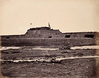Taku, China: the North Fort bearing raised British and French flags; Chinese corpses in the foreground; on the day of the fort's capture by the English and French armies during the Second China War. Photograph by Felice Beato, 1860.