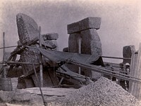 Stonehenge, England: the straightening of a leaning stone which is attached to a wooden frame and pulleys: north west view. Photograph, 1901.