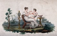 A mother feeding the child who is sitting on her lap. Coloured engraving.