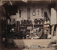 Japan: a curio shop selling traditional Japanese products like lacquer-ware, carved ivory and bamboo work; interior. Coloured photograph by Felice Beato, ca. 1868.