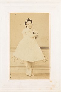 A man in drag poses with his arms crossed, wearing a ballerina costume. Photograph, 189-.
