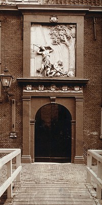 Doorway of the old pest house at Leiden, with a sculptured stone relief above, dated 1660. Photograph.