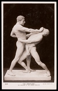 Actors pose as "The Wrestlers" at the London Pavilion. Photographic postcard, 193-.