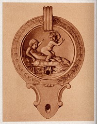 An ancient oil lamp: a relief on the lid shows two boys. Process print, 1921.