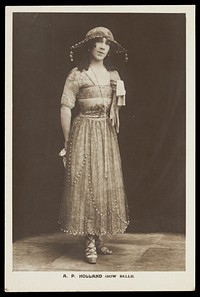 A.P. Holland in drag posing for the Bow Bells concert party. Photographic postcard, 191-.