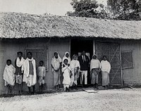 Golaghat, India: kala-azar patients with a doctor , outside a field laboratory. Photograph, 1900/1920 .