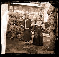 China: a Manchu bride in her wedding clothes with her maid, Beijing. Photograph by John Thomson, 1869.
