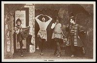 Amateur actors, some in drag, performing in the troupe "The Goods". Photographic postcard, 1918.