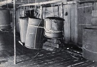 Sarawak: beehives hanging in a Sea Dayak's house. Photograph.