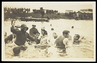 A group of men, one in drag, swimming and playing in a river.