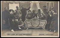 French prisoners of war performing a play at a prisoner of war camp in Cottbus. Photographic postcard by P. Tharan, 1916-1917.