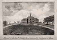 The Smallpox Hospital, St Pancras, London: with a wide expanse of grass in the foreground. Engraving.