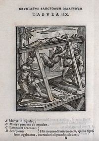 Martyrdom of two male saints, bound to the rack with flames beneath. Woodcut.