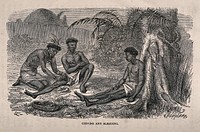 An African medicine man cupping and bleeding two patients. Wood engraving by Dalziel after J. Leech.